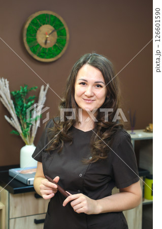Portrait of a woman - massage parlor worker indoors 126601590