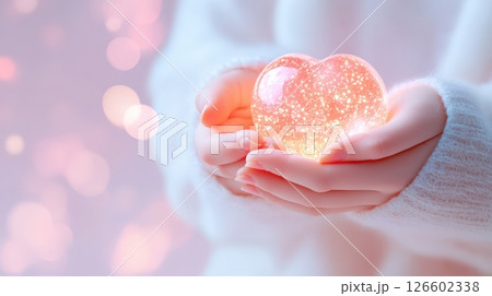 Hands Holding Glowing Heart in Soft Pink Light Emotional Connection and Tender Care Concept 126602338