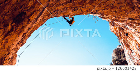 Man is climbing, training in the mountains. Man is climbing, training in the mountains. 126603428