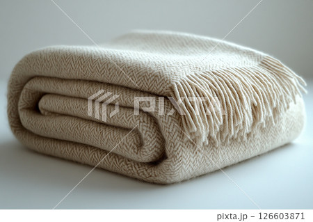 Alpaca wool throw blanket on a white background. For minimalist luxury living room. 126603871