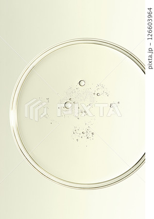 The texture of a cosmetic serum or body gel in a Petri dish. The texture of a cosmetic serum or body gel in a Petri dish. 126603964