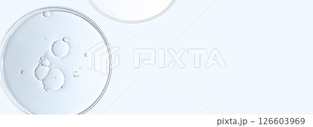 The texture of a cosmetic serum or body gel in a Petri dish. The texture of a cosmetic serum or body gel in a Petri dish. 126603969
