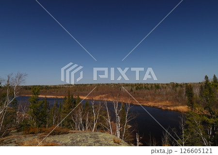 river among coniferous forest and rocks, northern nature river among coniferous forest and rocks, northern nature 126605121