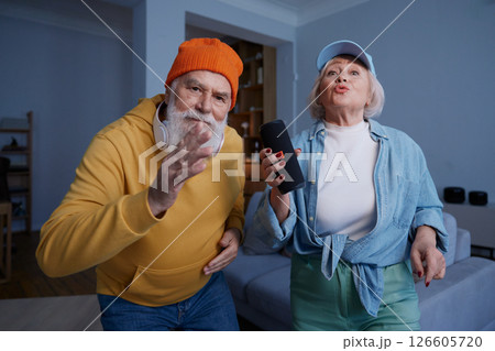 Elderly couple wearing trendy fashion outfit with youth clothing style Elderly couple wearing trendy fashion outfit with youth clothing style 126605720