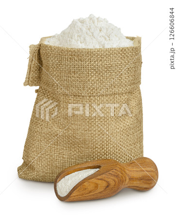 White flour in a paper bag and wooden scoop isolated on white background 126606844