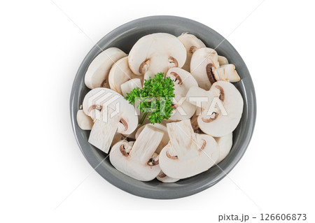 Fresh mushroom champignon slices in a ceramic bowl isolated on white background. Top view. Flat lay 126606873