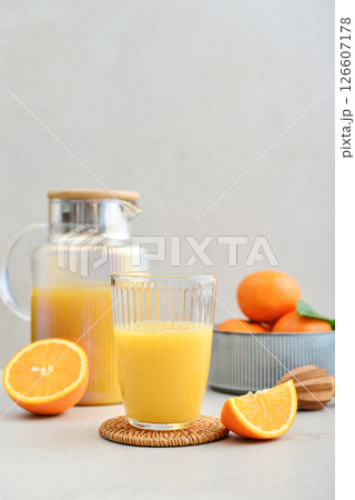 Orange fresh squeezed juice in glass and glasses jug 126607178