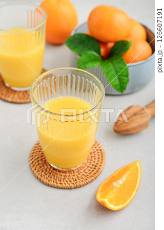 Orange fresh squeezed juice in glass and glasses jug 126607191