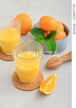 Orange fresh squeezed juice in glass and glasses jug 126607192