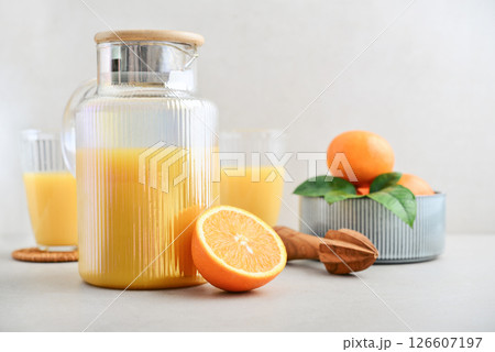 Orange fresh squeezed juice in glass and glasses jug Orange fresh squeezed juice in glass and glasses jug 126607197