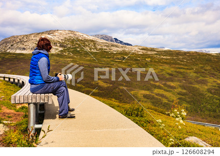 Woman on Vedahaugane rest stop, Norway Woman on Vedahaugane rest stop, Norway 126608294