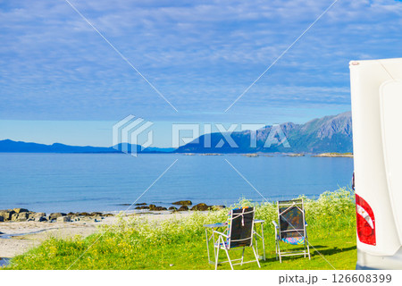 Camping on fjord. Camper and chairs Camping on fjord. Camper and chairs 126608399