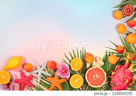 Tropical background with exotic fruits, Fruit sunny banner. Summer in a snapshot, oranges, dragon fruit, apricots, pitaya, grapefruit on a bright background with shadows from a palm tree, template 126608595