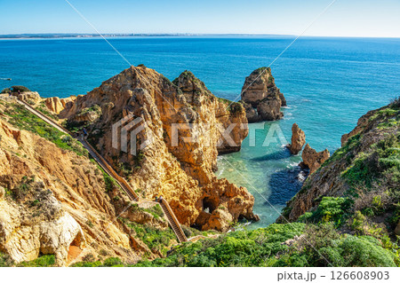 Ponta da Piedade is a unique rock formation with famous grottos in the ocean at Lagos, Algrave, Portugal Ponta da Piedade is a unique rock formation with famous grottos in the ocean at Lagos, Algrave, Portugal 126608903