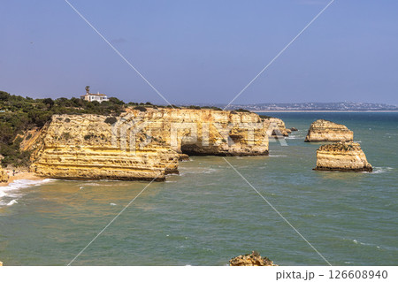 Praia da Marinha Beach among rock islets and cliffs seen from Seven Hanging Valleys Trail, Algarve, Portugal 126608940