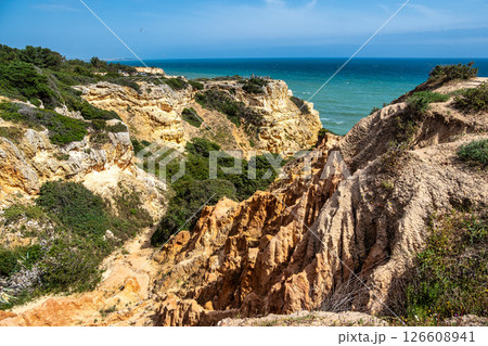 Praia da Marinha Beach among rock islets and cliffs seen from Seven Hanging Valleys Trail, Algarve, Portugal 126608941