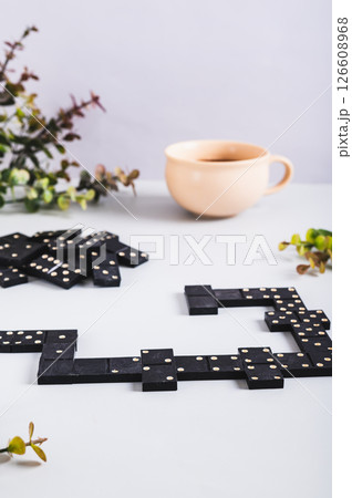 A calm domino board game for leisure on the table vertical view 126608968