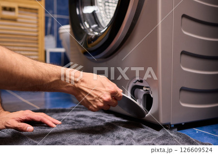 Repairing a Washing Machine Hose Connection at Home Requires Handy Skills and Tools Repairing a Washing Machine Hose Connection at Home Requires Handy Skills and Tools 126609524