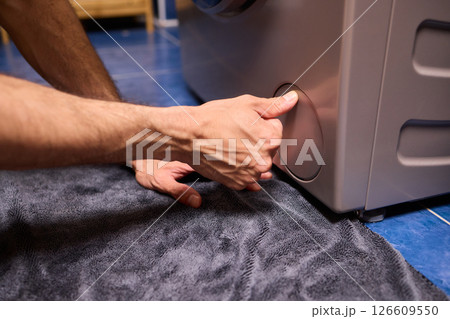 Repairing a Washing Machine Hose Connection at Home Requires Handy Skills and Tools Repairing a Washing Machine Hose Connection at Home Requires Handy Skills and Tools 126609550