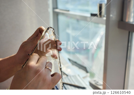 Hands actively engaged in working on advanced technology with various modern gadgets and devices 126610540