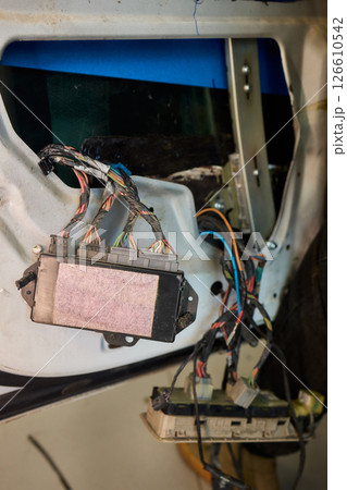 Automotive Repair Skilled Hands Working on Car Wiring for Efficient Performance and Safety Automotive Repair Skilled Hands Working on Car Wiring for Efficient Performance and Safety 126610542