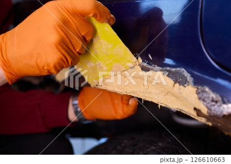 The Auto Body Repair Process includes proper Putty Application techniques and effective methods 126610663
