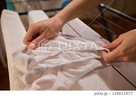 Laundry Day Freshly Cleaned Underwear Elegantly Hanging Outside to Dry in the Sun Laundry Day Freshly Cleaned Underwear Elegantly Hanging Outside to Dry in the Sun 126611077