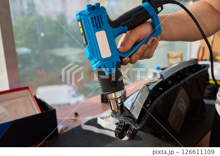 Careful precision is essential when installing a car headlight assembly for optimal performance Careful precision is essential when installing a car headlight assembly for optimal performance 126611109