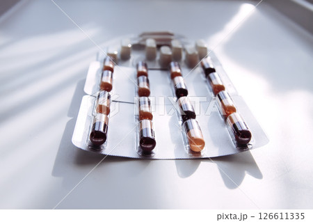 Pills on light background. Medicine theme. 126611335