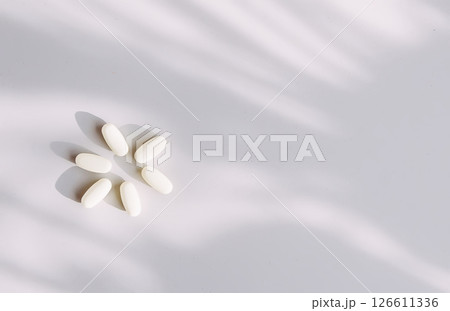 Pills on light background. Medicine theme. 126611336
