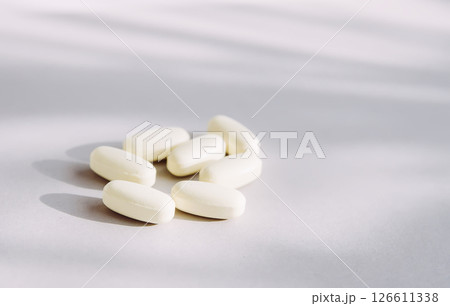 Pills on light background. Medicine theme. 126611338