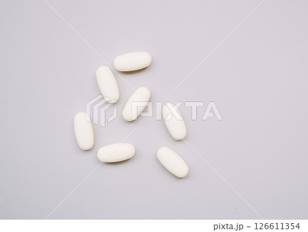Pills on light background. Medicine theme. 126611354