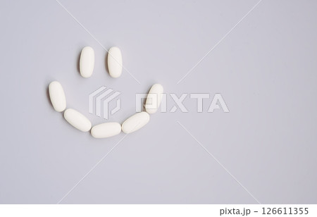 Pills on light background. Medicine theme. Pills on light background. Medicine theme. 126611355
