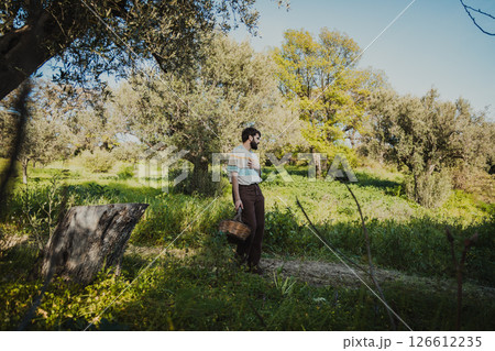 Farmer Walks In Nature With His Wicker Basket 126612235