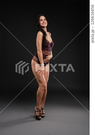 Woman gracefully dancing in elegant pose showcasing ballet beauty Woman gracefully dancing in elegant pose showcasing ballet beauty 126616856
