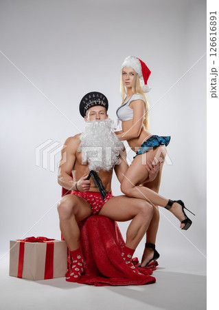 Couple engages in festive roleplay with playful and seductive attire Couple engages in festive roleplay with playful and seductive attire 126616891