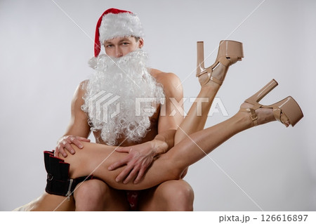Couple engaging in festive roleplay with playful elements and costumes 126616897
