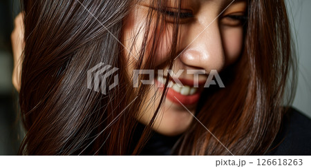 portraits of a beautiful smiling woman with luxurious, flowing chocolate brown hair. 126618263