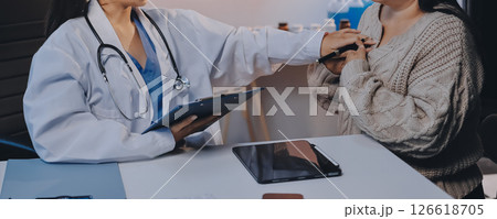Doctor use stethoscope examining respiratory system and consultations for the elderly patients, talking check-up health or sharing test results 126618705