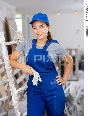 Portrait of smiling young woman repairer 126619097