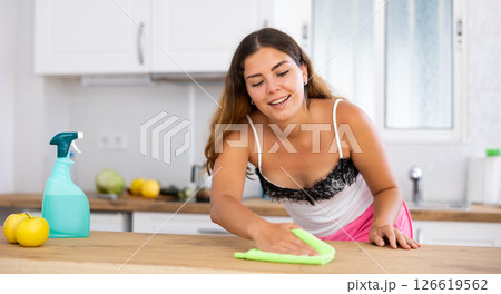 Woman housewife cleaning furniture at home kitchen 126619562