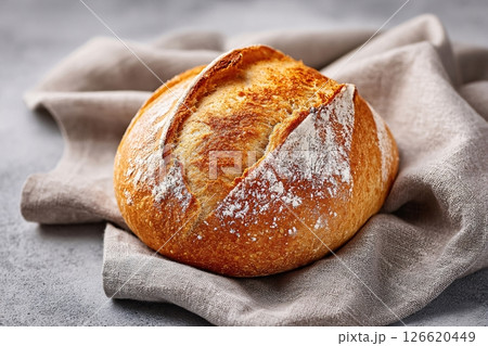 tempting bread roll in the rustic corner on a light gray background 126620449