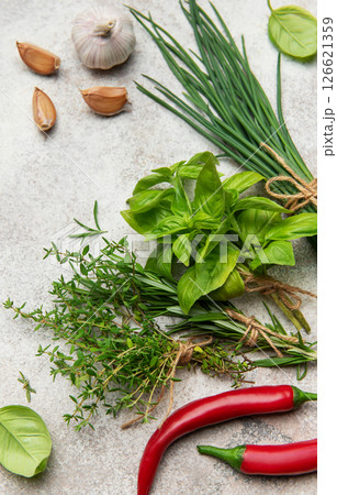 Fresh herbs and spices on gray background for healthy cuisine Fresh herbs and spices on gray background for healthy cuisine 126621359