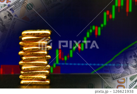 Photo a gold bars the candlestick chart and US dollar background , Fluctuations in gold prices concept. 126621938