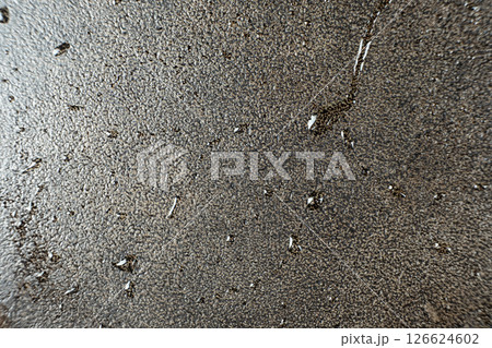Water droplets on a cast iron macro surface. Cast iron cookware care, rust resistant, abstract pattern 126624602