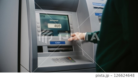 Unrecognizable Person Entering PIN Code. Error Message on Cash Machine Display Due to Lost Connection Unrecognizable Person Entering PIN Code. Error Message on Cash Machine Display Due to Lost Connection 126624648