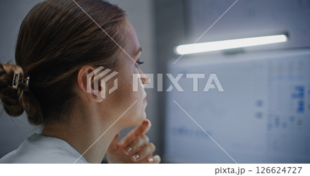 Close Up of Female Financial Analyst Working on Computer, Monitoring Real-Time Stocks Close Up of Female Financial Analyst Working on Computer, Monitoring Real-Time Stocks 126624727