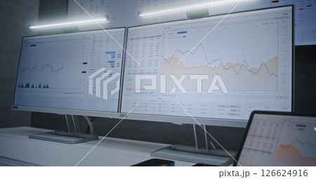 Financial Analyst Analyzing Real-Time Stocks on Computer and Digital Tablet, Feeling Nervous 126624916