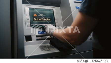 Cleaning Service Specialist Wiping Out of Service ATM with Microfiber Cloth 126624945