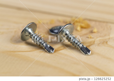 wooden board made of pine and self-tapping screws for wood wooden board made of pine and self-tapping screws for wood 126625252
